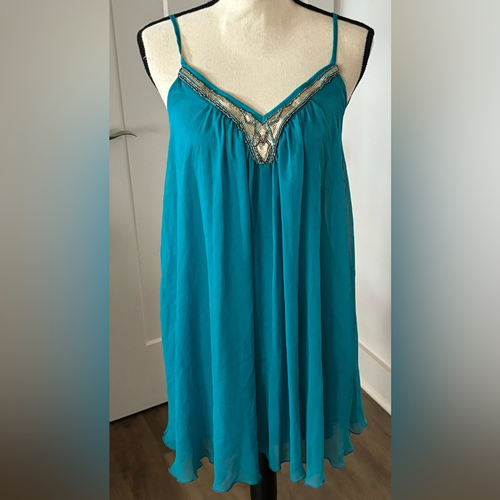 Teal spaghetti strap dress.  Flowing at the bottom. Loose fit. Size S.